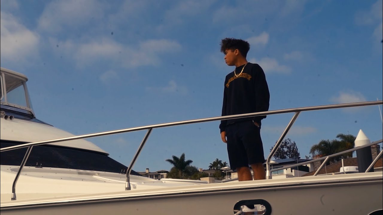 Francis standing on the bow of a boat in the Agree With The Lord music video
